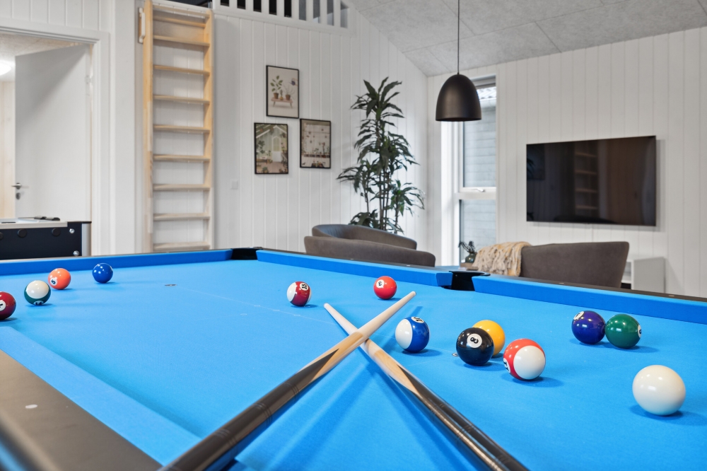 Neben den vielen schönen Stunden, die man im Poolbereich des Hauses verbringen kann, bietet das Luxusferienhaus 633 auch Spielevergnügen bei Billard/Tischtennis und Darts