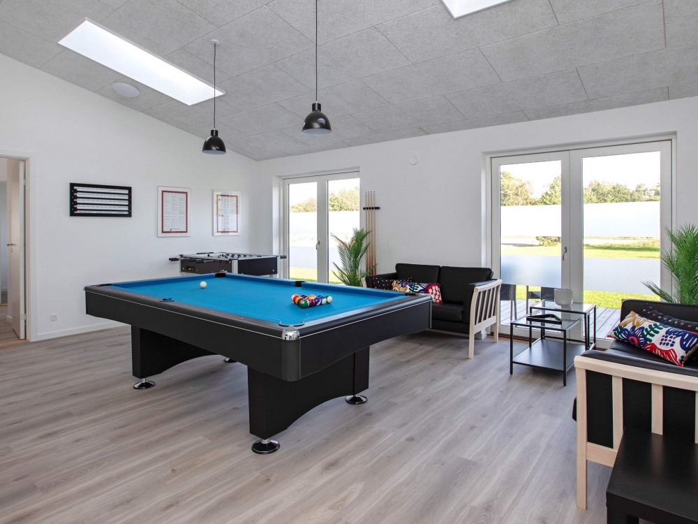 Neben den vielen schönen Stunden, die man im Poolbereich des Hauses verbringen kann, bietet das Luxusferienhaus 641 auch Spielevergnügen bei Billard/Tischtennis und Darts
