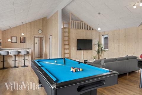 Neben den vielen schönen Stunden, die man im Poolbereich des Hauses verbringen kann, bietet das Luxusferienhaus 304 auch Spielevergnügen bei Billard/Tischtennis und Darts