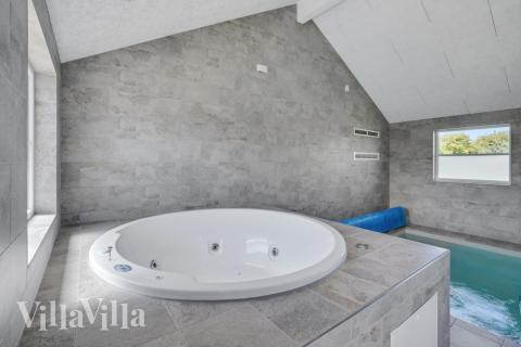 Genießen Sie den warmen Whirlpool im Luxusferienhaus Nr. 246 in Südjütland