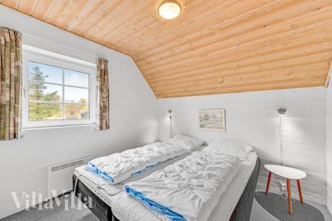 Eines der 9 Schlafzimmer im Luxusferienhaus Nr. 145