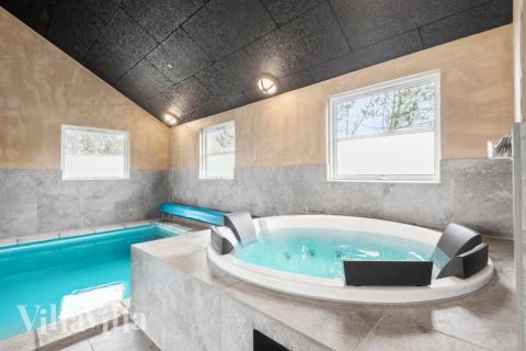 Genießen Sie den warmen Whirlpool im Luxusferienhaus Nr. 167 in Westjütland