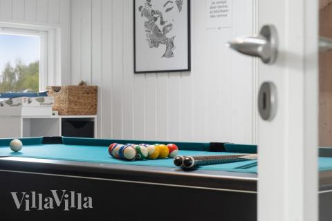Neben den vielen schönen Stunden, die man im Poolbereich des Hauses verbringen kann, bietet das Luxusferienhaus 212 auch Spielevergnügen bei Billard/Tischtennis und Darts
