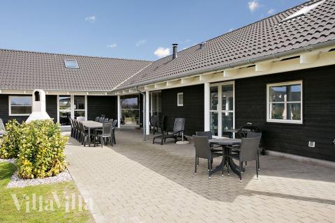 Genießen Sie einen Grillabend auf der Terrasse des Luxusferienhauses Nr. 214 in Lolland/Falster/Mön