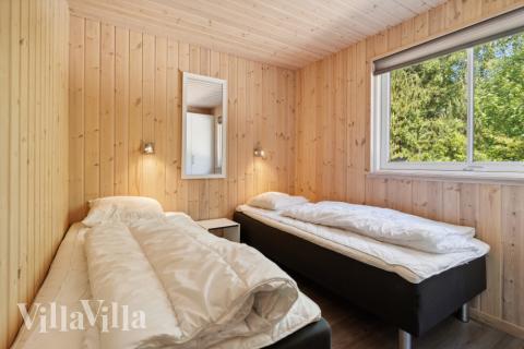 Eines der 9 Schlafzimmer im Luxusferienhaus Nr. 261