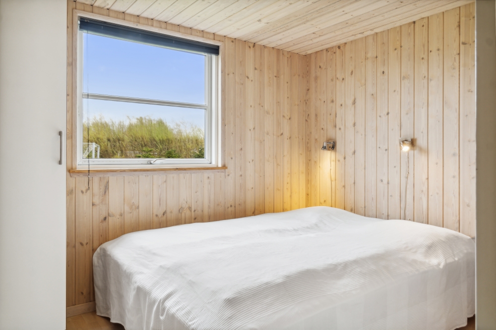Eines der 9 Schlafzimmer im Luxusferienhaus Nr. 202