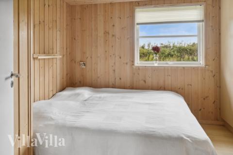 Eines der 9 Schlafzimmer im Luxusferienhaus Nr. 208