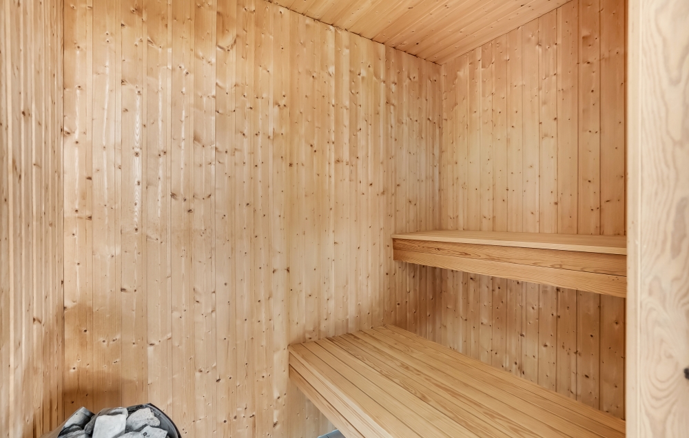 Genießen Sie die heiße Sauna im Luxusferienhaus Nr. 299 für 16 Personen