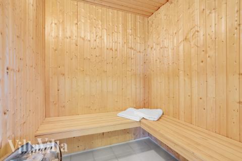 Genießen Sie die heiße Sauna im Luxusferienhaus Nr. 206 für 24 Personen
