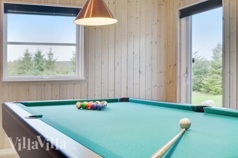 Neben den vielen schönen Stunden, die man im Poolbereich des Hauses verbringen kann, bietet das Luxusferienhaus 206 auch Spielevergnügen bei Billard/Tischtennis und Darts