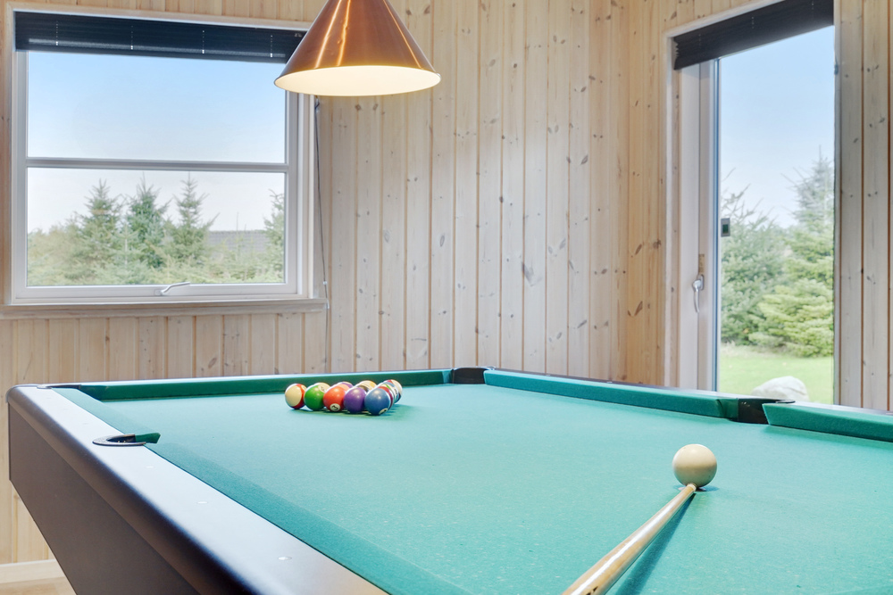 Neben den vielen schönen Stunden, die man im Poolbereich des Hauses verbringen kann, bietet das Luxusferienhaus 206 auch Spielevergnügen bei Billard/Tischtennis und Darts