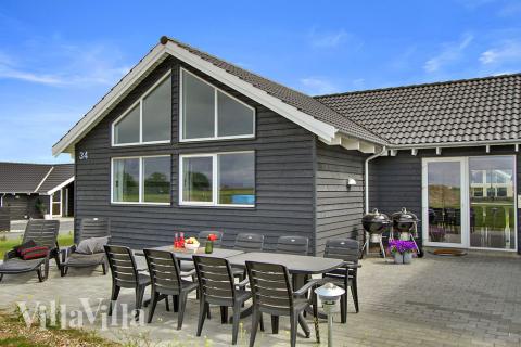 Genießen Sie einen Grillabend auf der Terrasse des Luxusferienhauses Nr. 319 in Fünen und seine Inseln