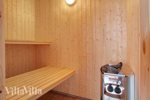 Genießen Sie die heiße Sauna im Luxusferienhaus Nr. 337 für 16 Personen