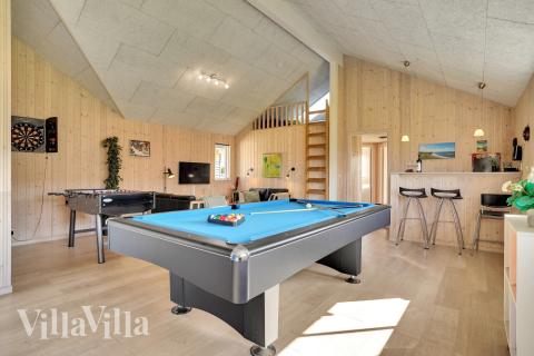 Neben den vielen schönen Stunden, die man im Poolbereich des Hauses verbringen kann, bietet das Luxusferienhaus 338 auch Spielevergnügen bei Billard/Tischtennis und Darts