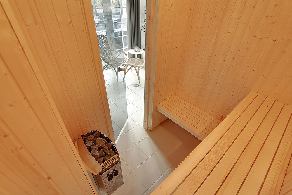Genießen Sie die heiße Sauna im Luxusferienhaus Nr. 342 für 24 Personen