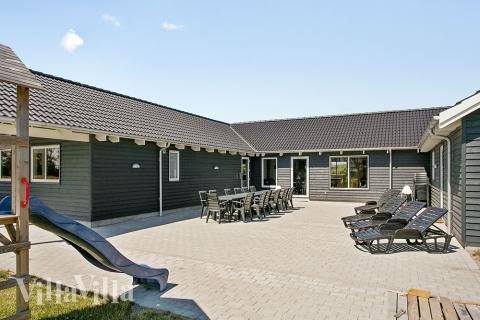 Genießen Sie einen Grillabend auf der Terrasse des Luxusferienhauses Nr. 343 in Lolland/Falster/Mön