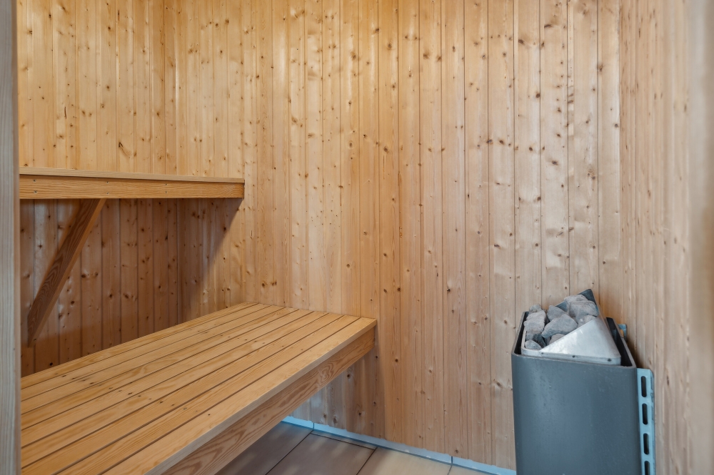 Genießen Sie die heiße Sauna im Luxusferienhaus Nr. 345 für 16 Personen