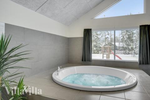 Genießen Sie den warmen Whirlpool im Luxusferienhaus Nr. 362 in Nordseeland