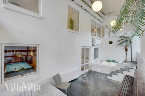 Genießen Sie den warmen Whirlpool im Luxusferienhaus Nr. 373 in Limfjord