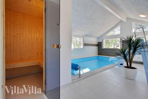 Genießen Sie die heiße Sauna im Luxusferienhaus Nr. 374 für 22 Personen