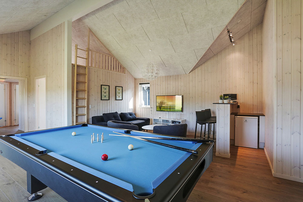 Neben den vielen schönen Stunden, die man im Poolbereich des Hauses verbringen kann, bietet das Luxusferienhaus 377 auch Spielevergnügen bei Billard/Tischtennis und Darts
