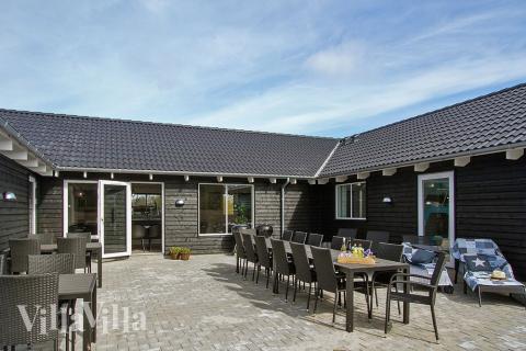 Das Luxusferienhaus Nr. 394 hat eine tolle Terrasse, die mit hochwertigen Gartenmöbeln für 22 Personen ausgestattet ist.