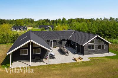 Dieses schöne Poolhaus Nr. 394 mit Platz für 22 Personen liegt in Ostjütland
