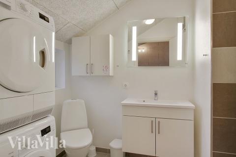 Eines der Badezimmer im Luxusferienhaus Nr. 702