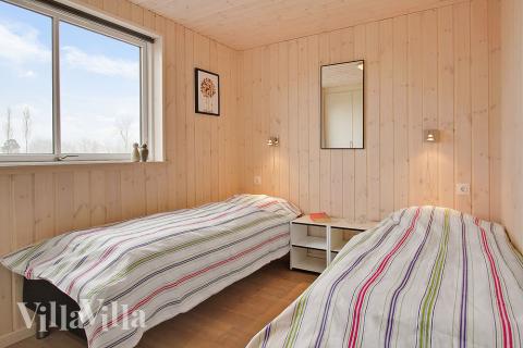 Eines der 8 Schlafzimmer im Luxusferienhaus Nr. 703