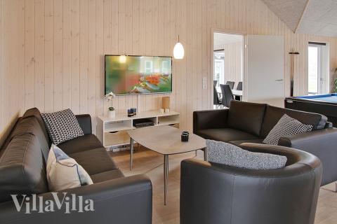 Aufenthaltsraum mit Platz für 20 im Luxusferienhaus Nr. 703.