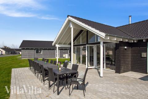 Genießen Sie einen Grillabend auf der Terrasse des Luxusferienhauses Nr. 704 in Deutschland