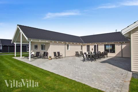 Das Luxusferienhaus Nr. 705 hat eine tolle Terrasse, die mit hochwertigen Gartenmöbeln für 22 Personen ausgestattet ist.