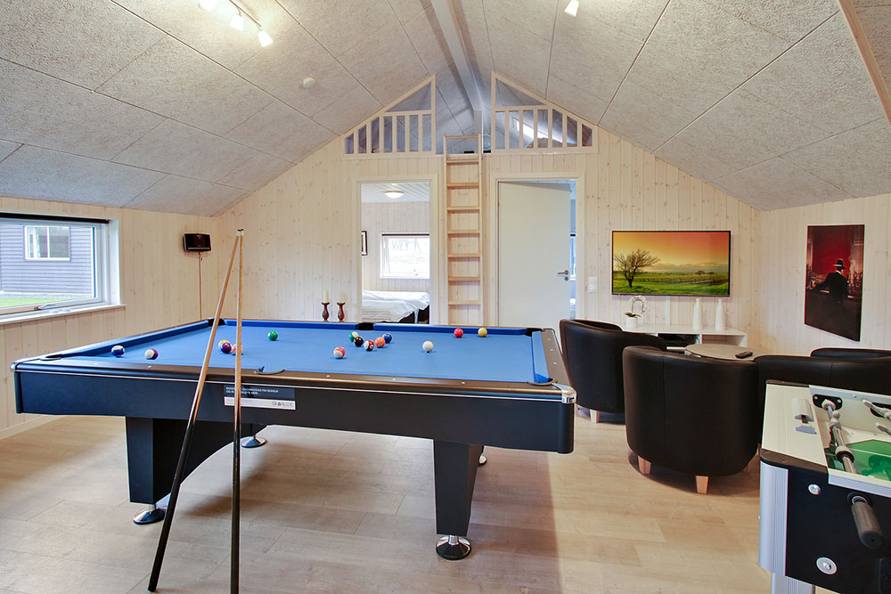 Neben den vielen schönen Stunden, die man im Poolbereich des Hauses verbringen kann, bietet das Luxusferienhaus 708 auch Spielevergnügen bei Billard/Tischtennis und Darts
