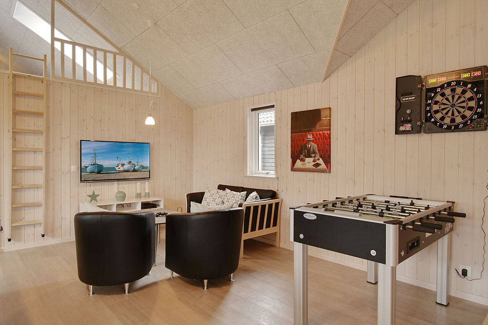 Aktivitätsraum im Luxusferienhaus Nr. 709 mit 6 Schlafzimmern und Platz für 16 Gäste.