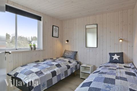 Eines der 8 Schlafzimmer im Luxusferienhaus Nr. 393