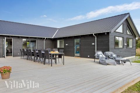 Genießen Sie einen Grillabend auf der Terrasse des Luxusferienhauses Nr. 395 in Nordseeland