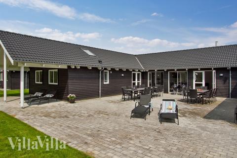 Genießen Sie einen Grillabend auf der Terrasse des Luxusferienhauses Nr. 714 in Deutschland