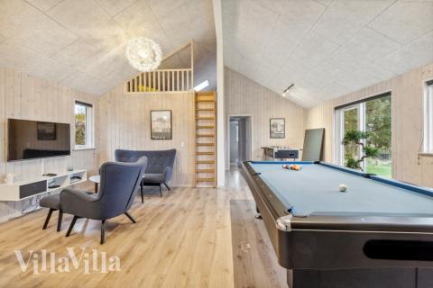 Das Luxusferienhaus 397 für 18 Personen hat einen großen Aktivitätsraum mit u. a. Billard und Darts