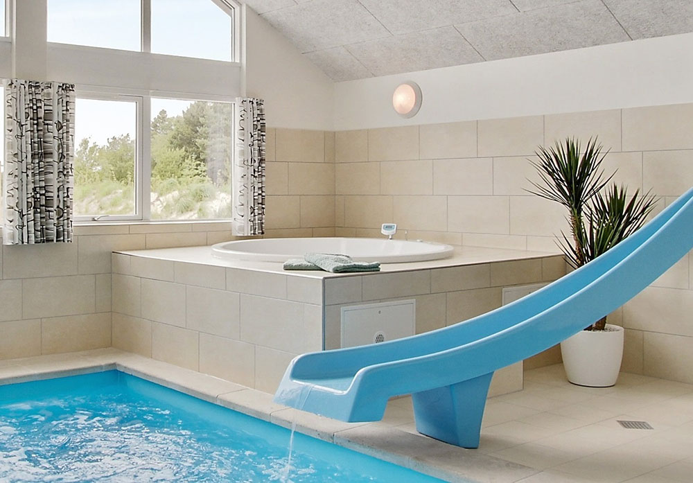 Genießen Sie den warmen Whirlpool im Luxusferienhaus Nr. 390 in Westjütland