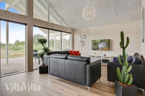 Aufenthaltsraum mit Platz für 18 im Luxusferienhaus Nr. 390.