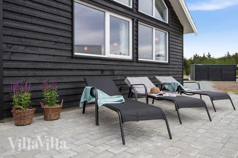 Das Luxusferienhaus Nr. 390 hat eine tolle Terrasse, die mit hochwertigen Gartenmöbeln für 18 Personen ausgestattet ist.