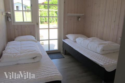 Eines der 9 Schlafzimmer im Luxusferienhaus Nr. 400