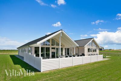 Dieses schöne Poolhaus Nr. 405 mit Platz für 18 Personen liegt in Limfjord