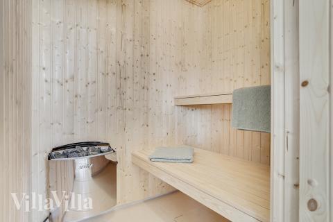 Genießen Sie die heiße Sauna im Luxusferienhaus Nr. 405 für 18 Personen