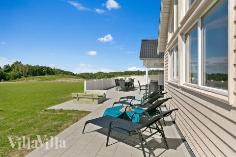 Das Luxusferienhaus Nr. 405 hat eine tolle Terrasse, die mit hochwertigen Gartenmöbeln für 18 Personen ausgestattet ist.