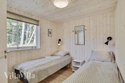 Eines der 9 Schlafzimmer im Luxusferienhaus Nr. 406