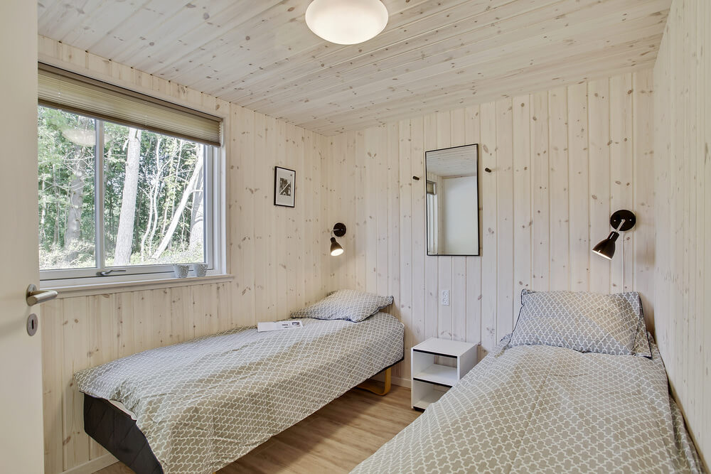 Eines der 9 Schlafzimmer im Luxusferienhaus Nr. 406