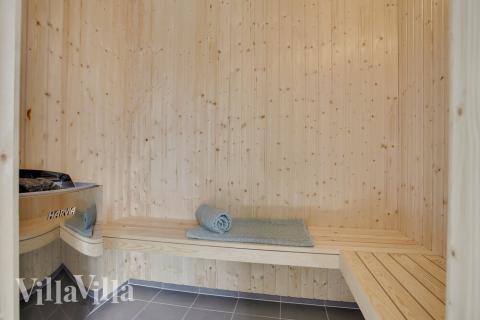 Genießen Sie die heiße Sauna im Luxusferienhaus Nr. 406 für 24 Personen