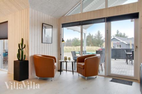 Aufenthaltsraum mit Platz für 22 im Luxusferienhaus Nr. 407.