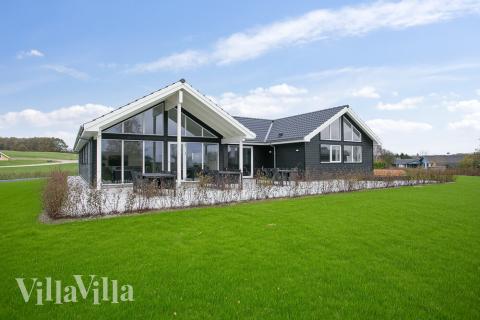 Genießen Sie einen Grillabend auf der Terrasse des Luxusferienhauses Nr. 392 in Fünen und seine Inseln